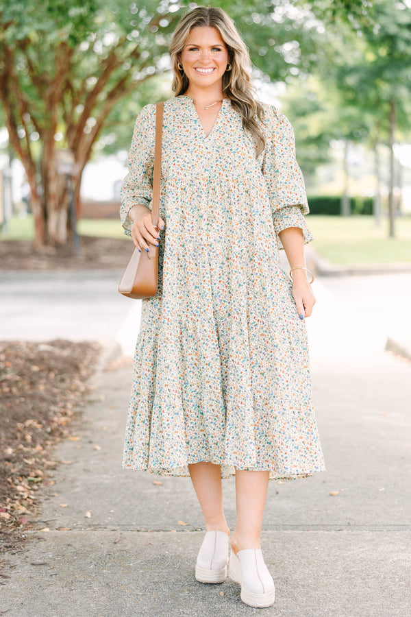 Plus Size cream floral midi dress with a ditsy print, split v-neck, and smocked cuff sleeves.