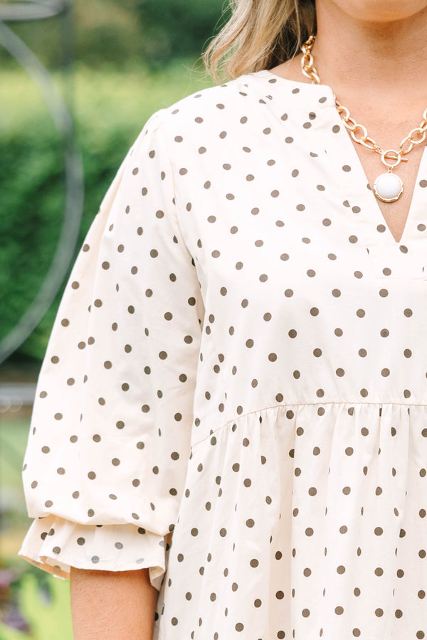 Plus Size cream tiered midi dress with brown polka dots, a V-neckline, and elbow-length sleeves.