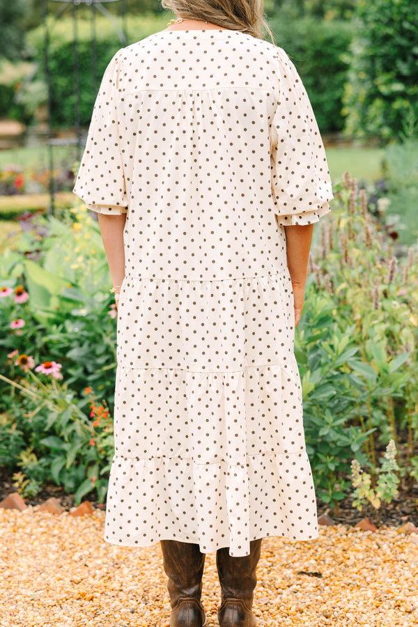 Plus Size cream tiered midi dress with brown polka dots, a V-neckline, and elbow-length sleeves.