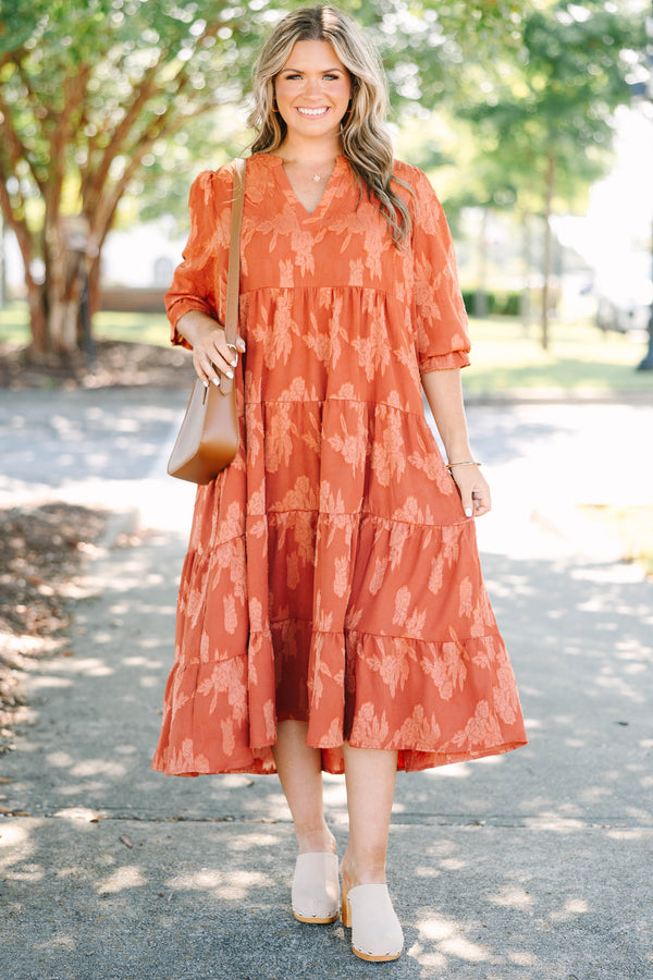 Plus Size orange tiered midi dress with a floral jacquard pattern, V-neckline, and 3/4 sleeves.