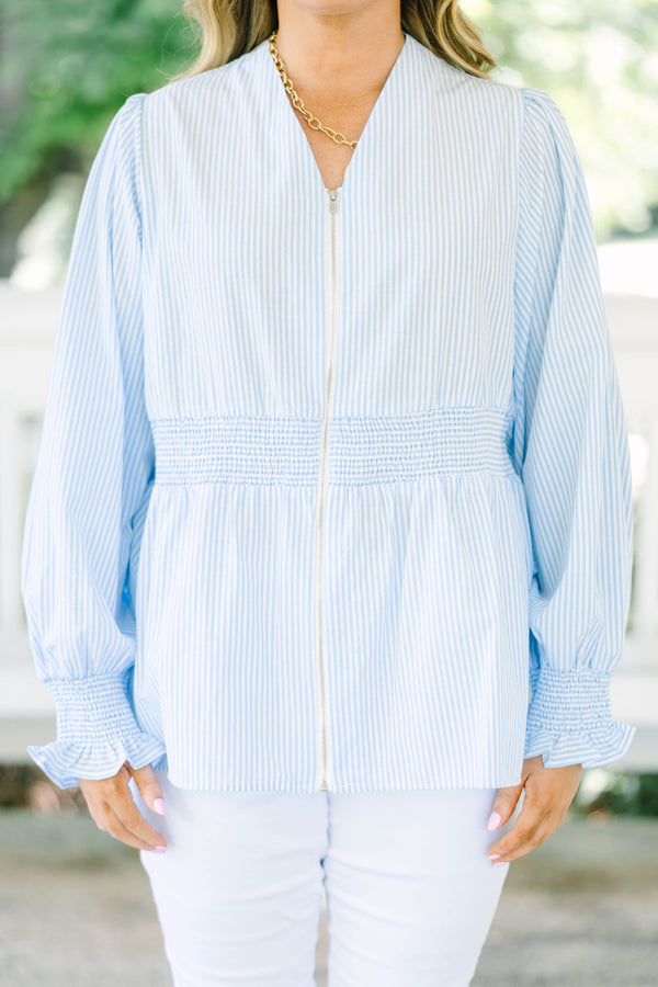 Plus Size light blue and white striped blouse with a zippered front and smocked waist.
