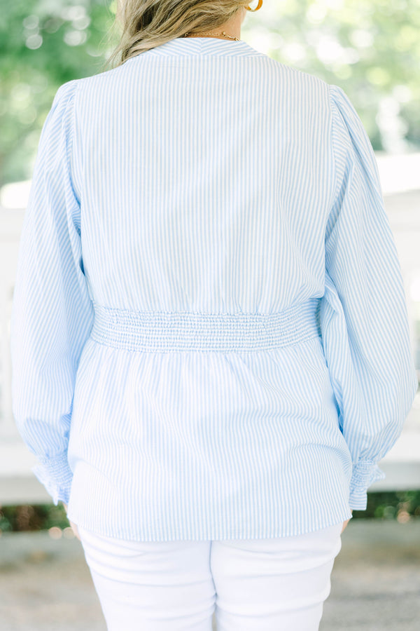 Plus Size light blue and white striped blouse with a zippered front and smocked waist.