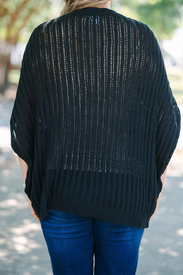 Plus Size black open-knit poncho sweater with a crew neckline and short, wide sleeves.