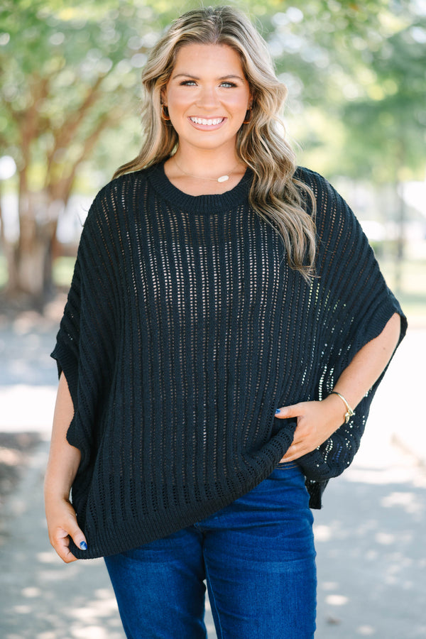 Plus Size black open-knit poncho sweater with a crew neckline and short, wide sleeves.