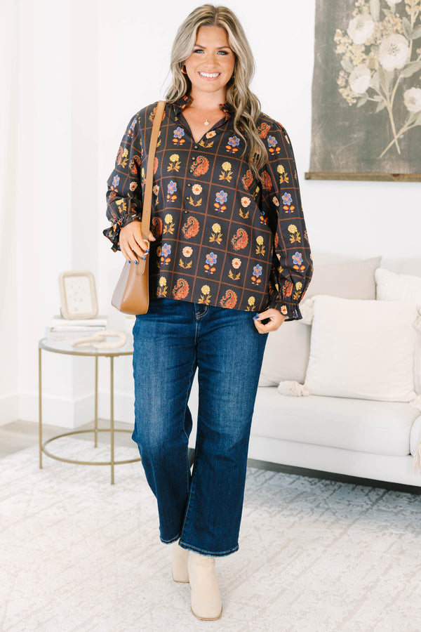 Plus size black cotton blouse with floral paisley print, flowy fit, and puff sleeves.