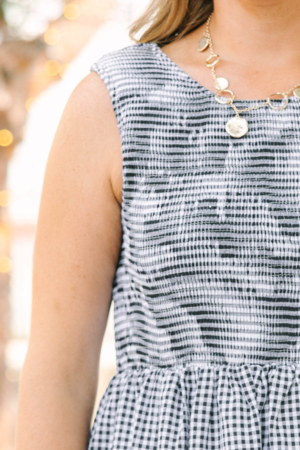 Plus Size black and white gingham midi dress with a sleeveless bodice and a tiered skirt.