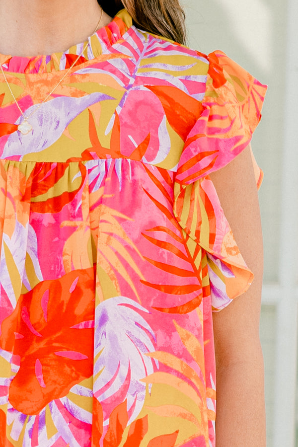Plus Size tropical floral print top with flutter sleeves and a ruffled neckline.