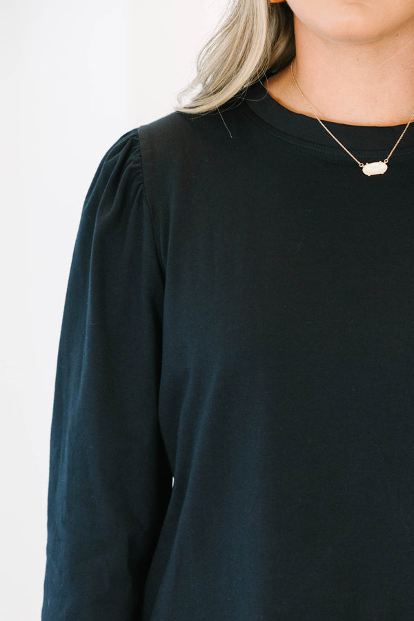 Plus Size black crew neck top with three quarter sleeves and a relaxed fit.