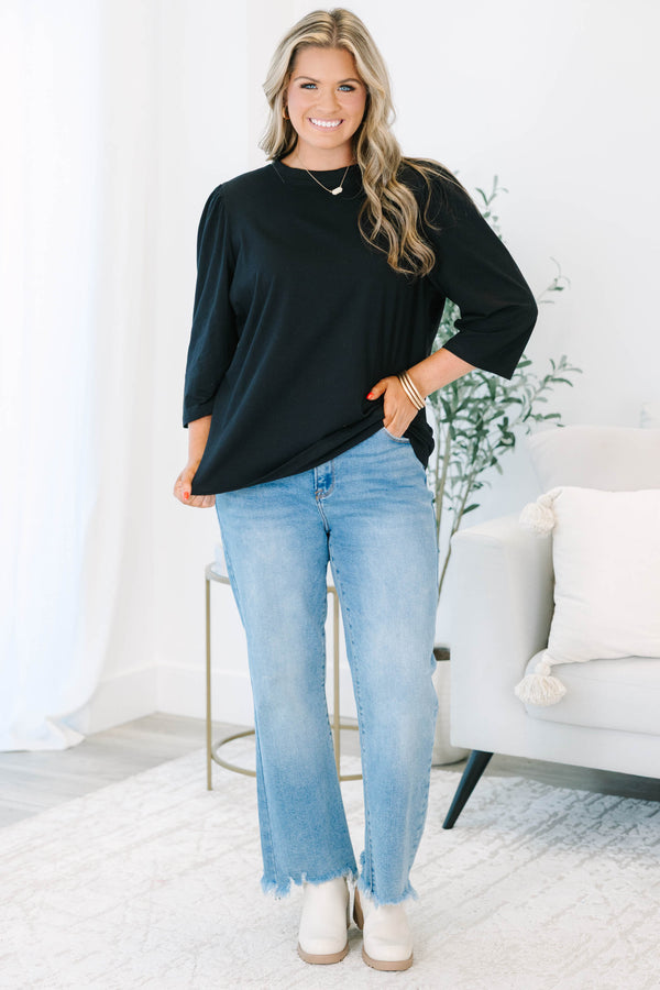Plus Size black crew neck top with three quarter sleeves and a relaxed fit.