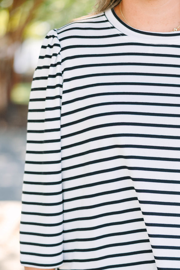 Plus size black and white striped top with 3/4 puff sleeves and a flowy cotton fit.