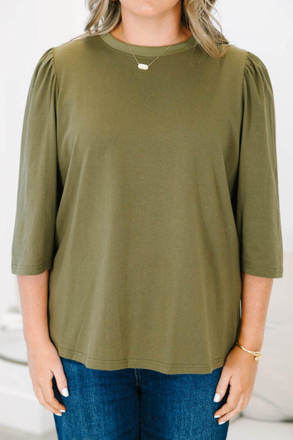 Plus size olive green top with puff sleeves and a relaxed fit
