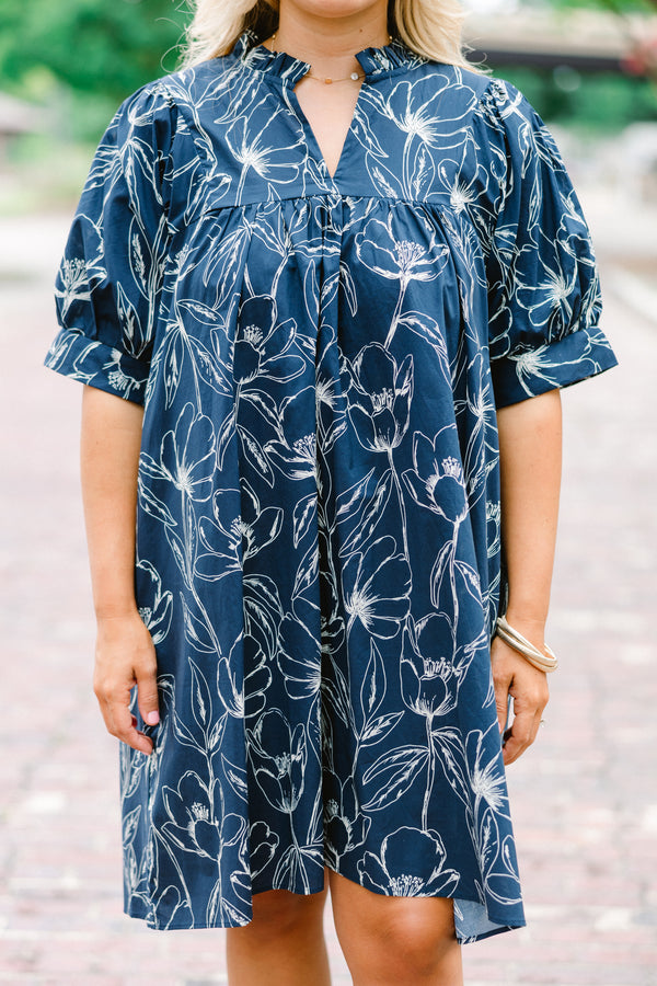 Chic Soul plus size clothing, navy baby doll dress with short sleeves and a white floral pattern throughout 