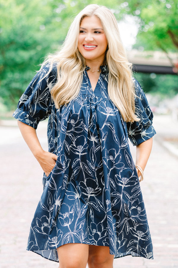Chic Soul plus size clothing, navy baby doll dress with short sleeves and a white floral pattern throughout 