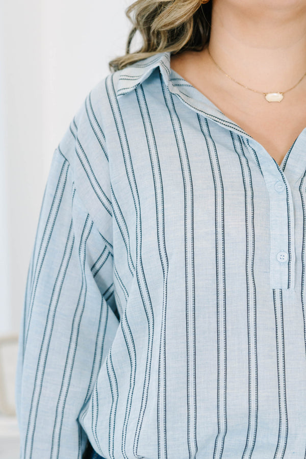 Plus Size blue and white vertical striped 100% cotton top with long sleeves and a tie-front hem.