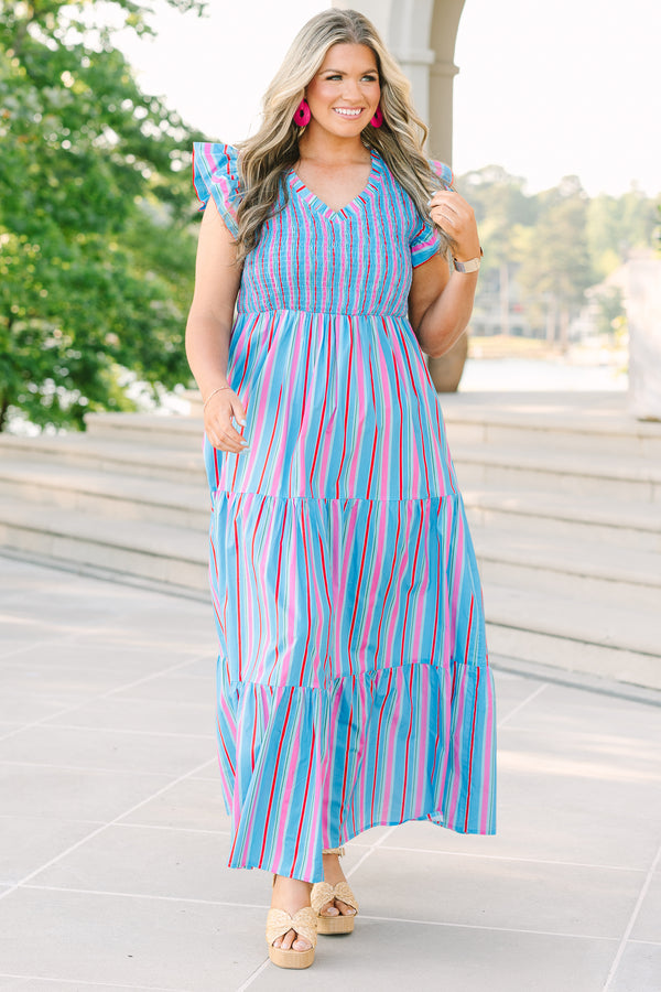 Plus Size blue tiered maxi dress with multi-colored stripes, smocked bodice, and flutter sleeves.