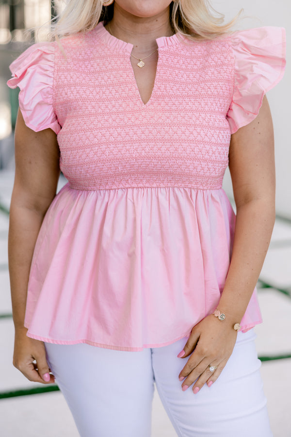 Chic Soul, Plus size clothing, pink top with smocked detailing on the top of the blouse and then a flare from under the bust as well as a flutter sleeve and a slight v-neckline 