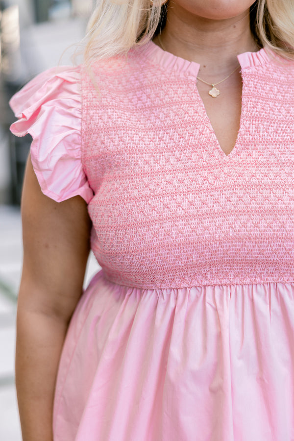 Chic Soul, Plus size clothing, pink top with smocked detailing on the top of the blouse and then a flare from under the bust as well as a flutter sleeve and a slight v-neckline 