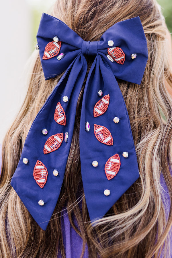 Chic Soul plus size clothing, navy blue hair bow with football patches and gemstones scattered across bow 