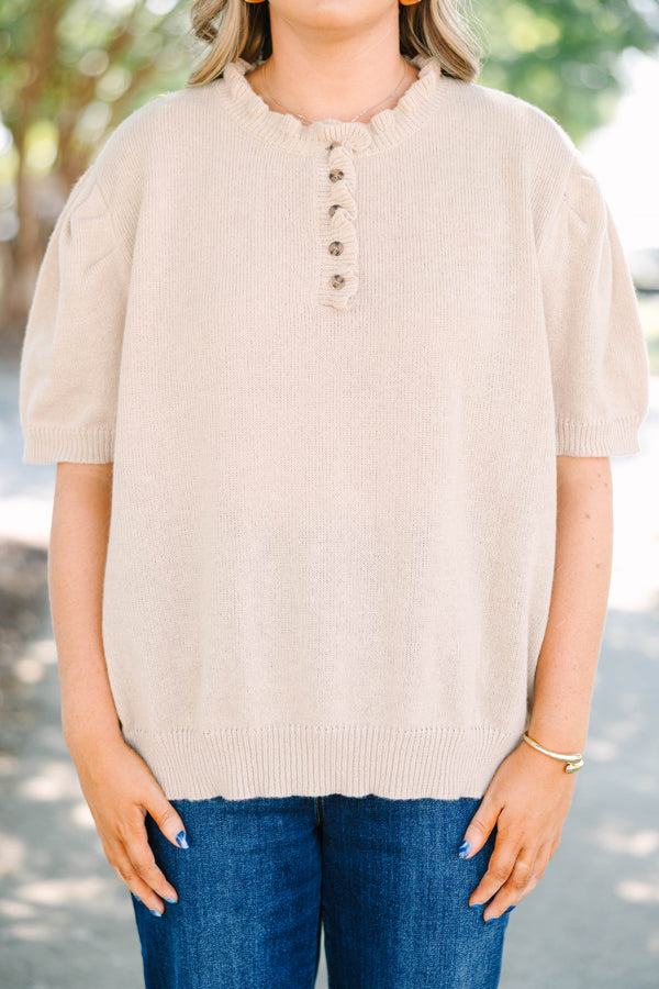 Plus size tan Sweater with short puff sleeves, ruffle neckline, and button details.