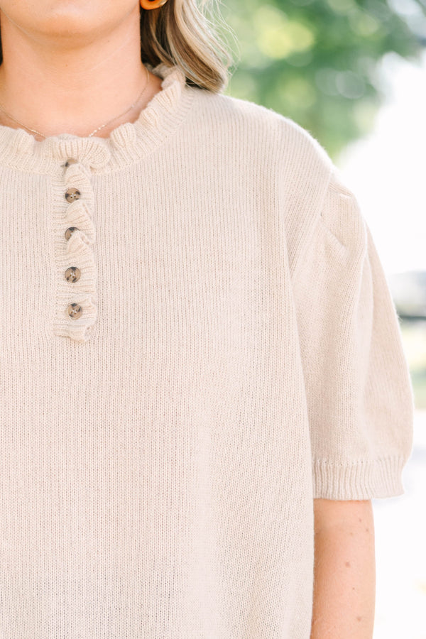 Plus size tan Sweater with short puff sleeves, ruffle neckline, and button details.