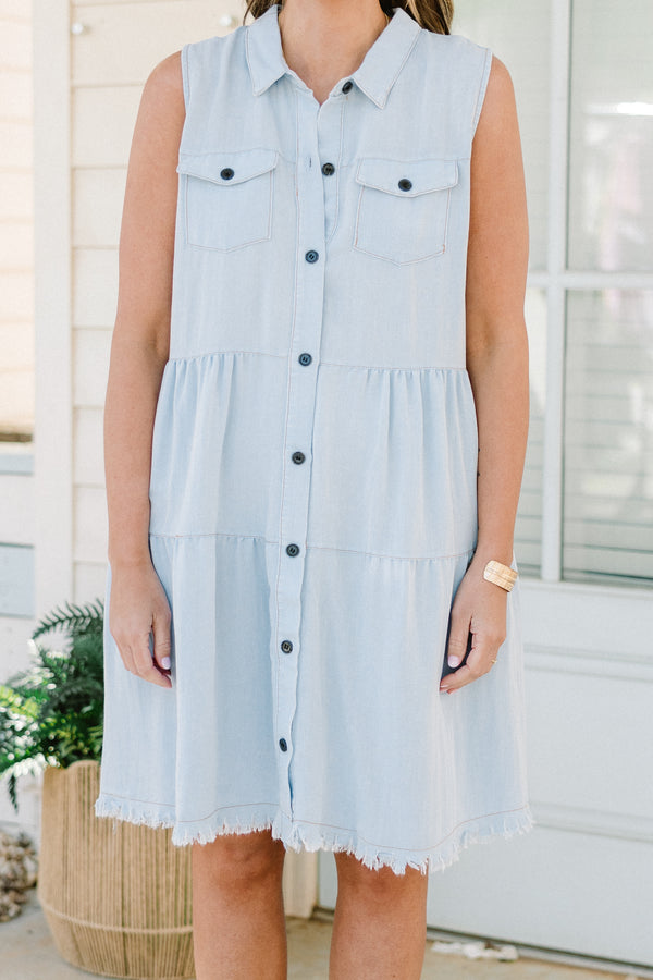 Chic Soul plus size clothing, sleeveless light denim blue ruffled baby doll dress with a collar and black button detailing with subtle fraying along the hemline 