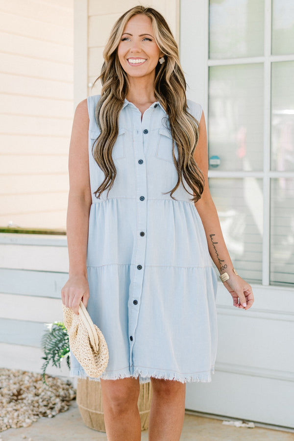 Chic Soul plus size clothing, sleeveless light denim blue ruffled baby doll dress with a collar and black button detailing with subtle fraying along the hemline 