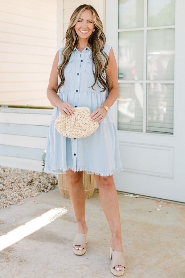 Chic Soul plus size clothing, sleeveless light denim blue ruffled baby doll dress with a collar and black button detailing with subtle fraying along the hemline 