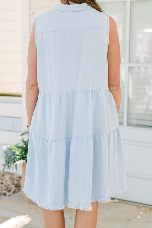 Chic Soul plus size clothing, sleeveless light denim blue ruffled baby doll dress with a collar and black button detailing with subtle fraying along the hemline 