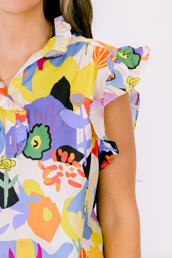 Chic Soul plus size clothing, white top with bold multicolor abstract pattern and flutter sleeves