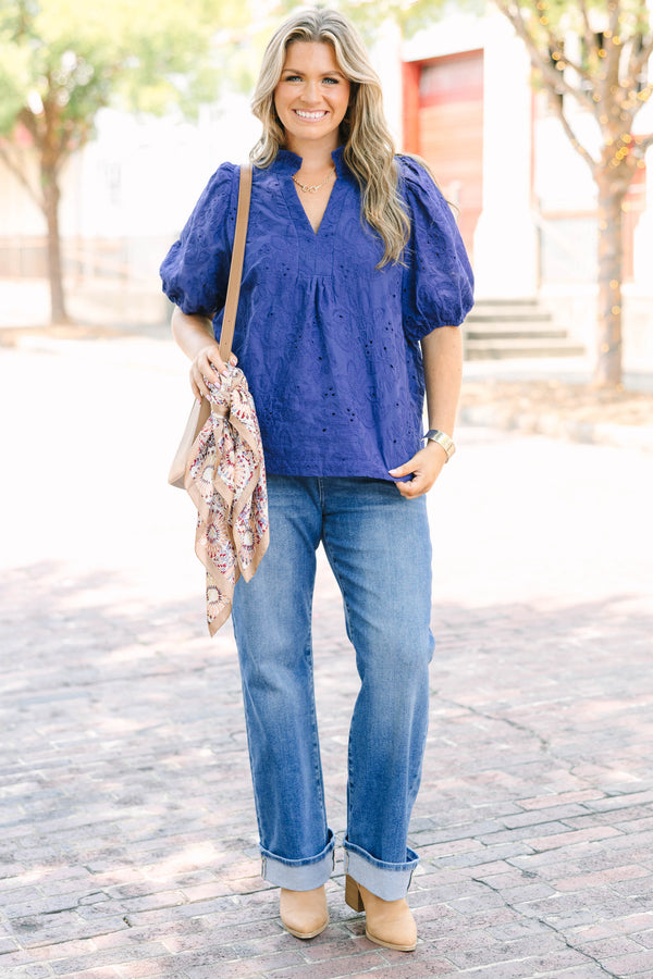 Plus Size navy blue embroidered blouse with puff sleeves and a split neckline.