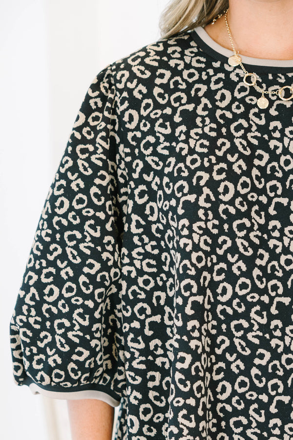 Plus Size leopard jacquard top with elastic puff sleeves, a crew neckline, and a relaxed fit.