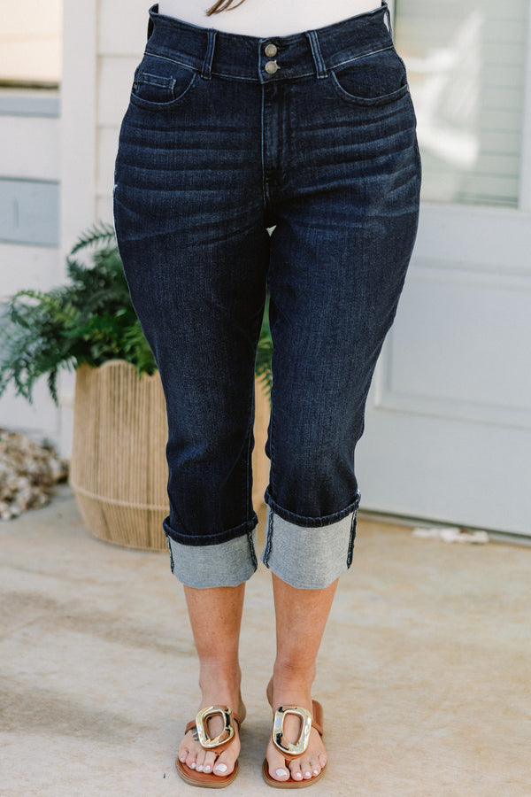 Chic Soul plus size clothing, mid-waisted dark-wash blue jean capris with a bronze button detailing and a cuffed bottom