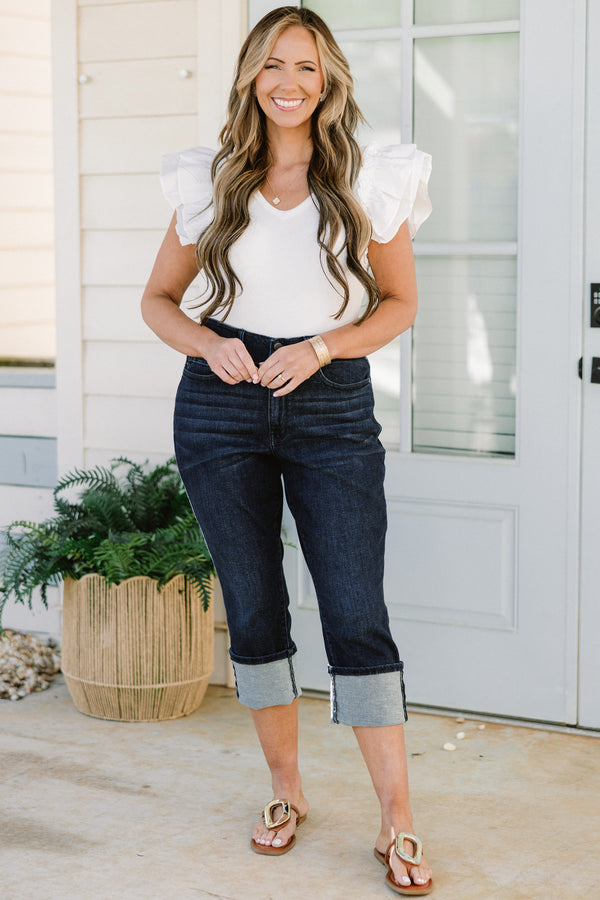 Chic Soul plus size clothing, mid-waisted dark-wash blue jean capris with a bronze button detailing and a cuffed bottom