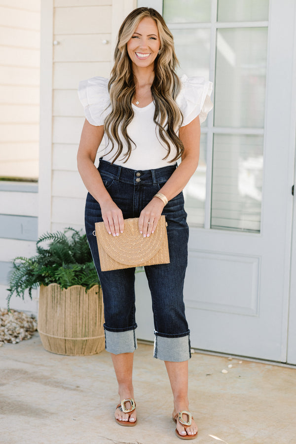 Chic Soul plus size clothing, mid-waisted dark-wash blue jean capris with a bronze button detailing and a cuffed bottom