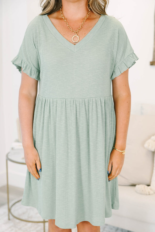 Plus Size sea green ribbed knit dress with a V-neckline, ruffled short sleeves, and a tiered skirt.