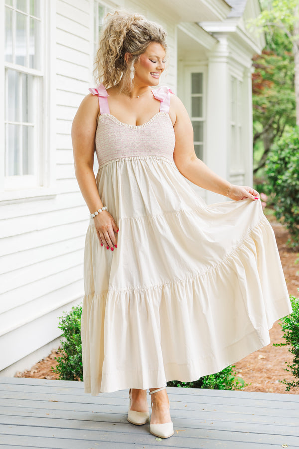 Chic Soul plus size clothing,  cream maxi dress with ruffles and pink ribbon ties on the shoulders 
