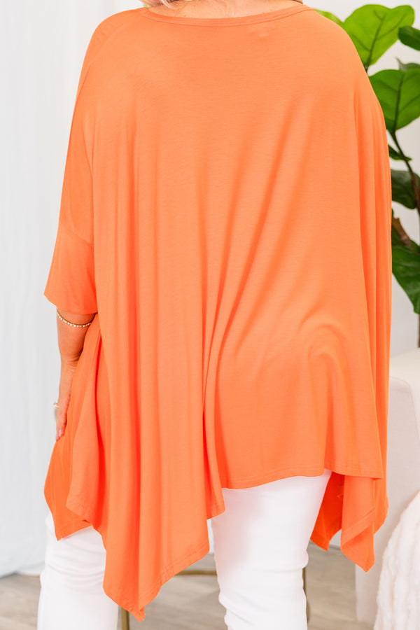 Chic Soul plus size clothing, short sleeve orange flowy top with wound neckline and longer length on the sides with slit on sides