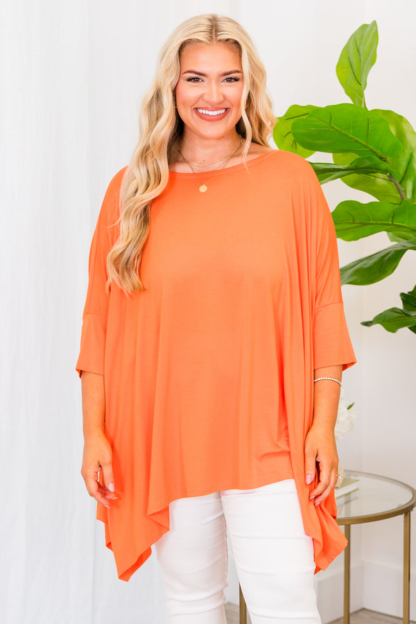 Chic Soul plus size clothing, short sleeve orange flowy top with wound neckline and longer length on the sides with slit on sides