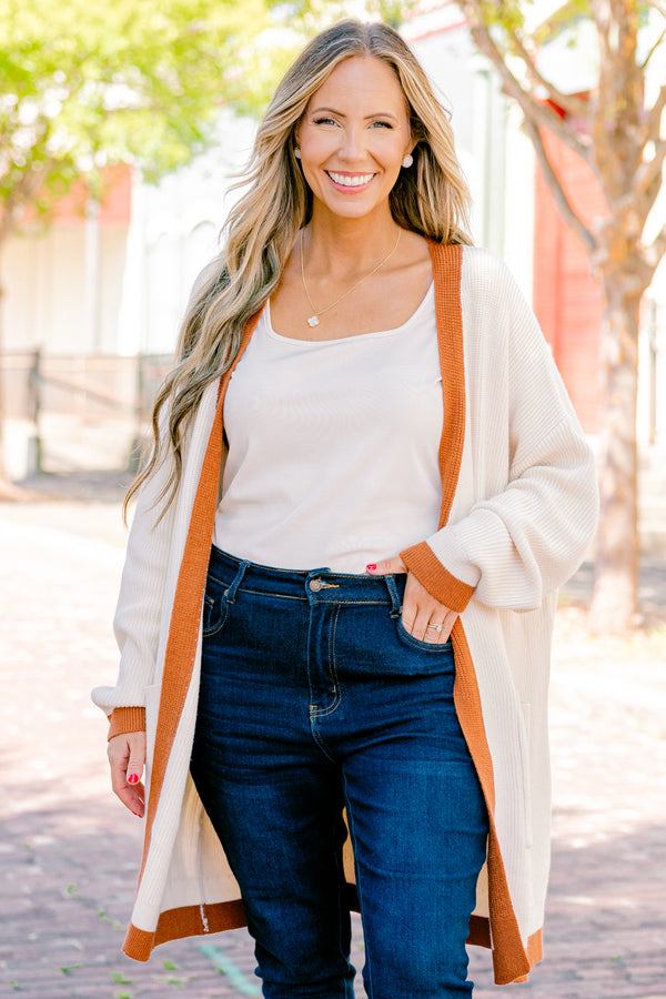 Chic Soul Plus size Clothing, cream long sleeve cardigan with a camel colored stripe going down the insides of the cardigan at the end of each sleeve and along the bottom 