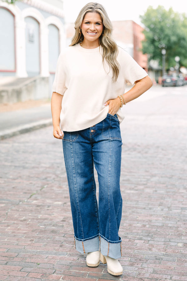 Plus Size dark wash wide leg jeans with a button fly, front seam details, and versatile cuffed hems.