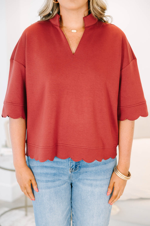 Plus Size wine-colored short sleeve top with a v-neckline and scalloped hem 