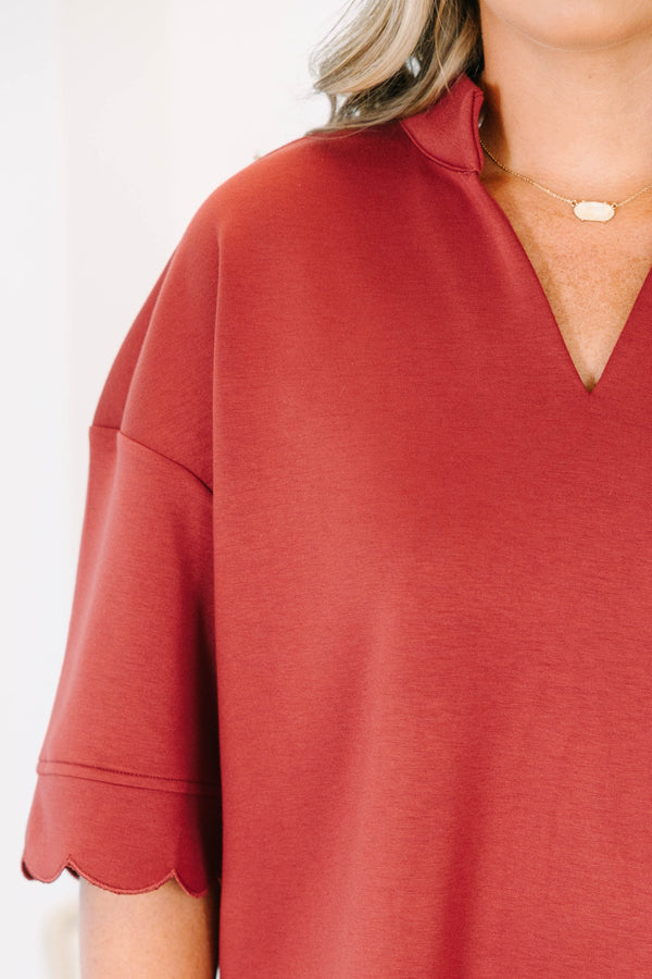 Plus Size wine-colored short sleeve top with a v-neckline and scalloped hem 
