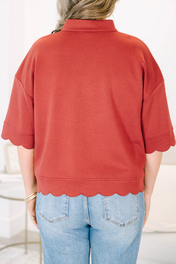 Plus Size wine-colored short sleeve top with a v-neckline and scalloped hem 