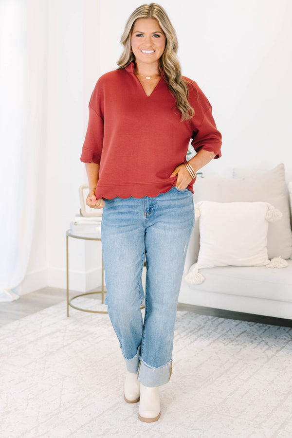 Plus Size wine-colored short sleeve top with a v-neckline and scalloped hem 