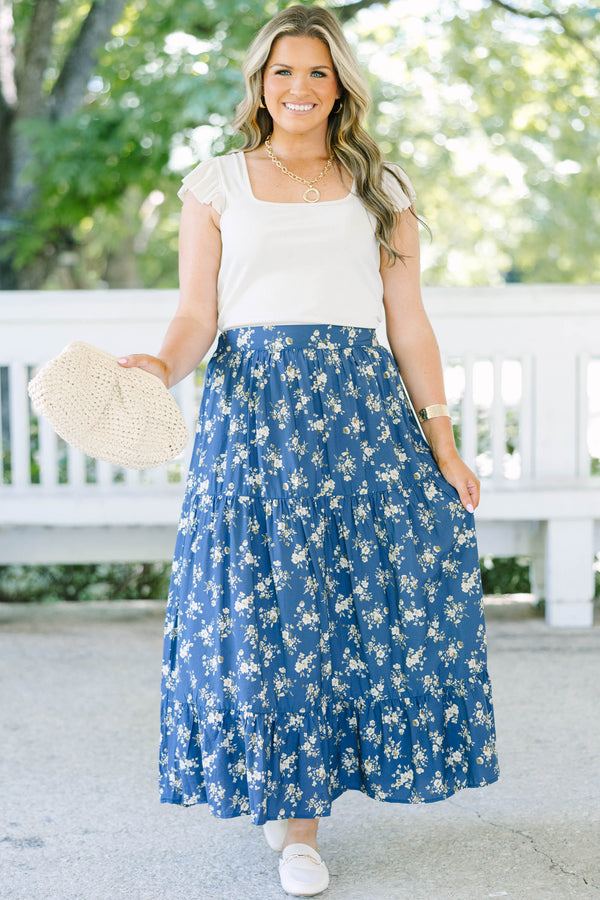 Plus Size navy floral tiered maxi skirt with an elastic waistband and functional pockets.