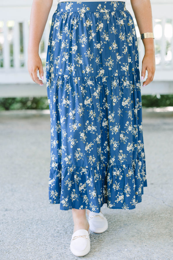 Plus Size navy floral tiered maxi skirt with an elastic waistband and functional pockets.