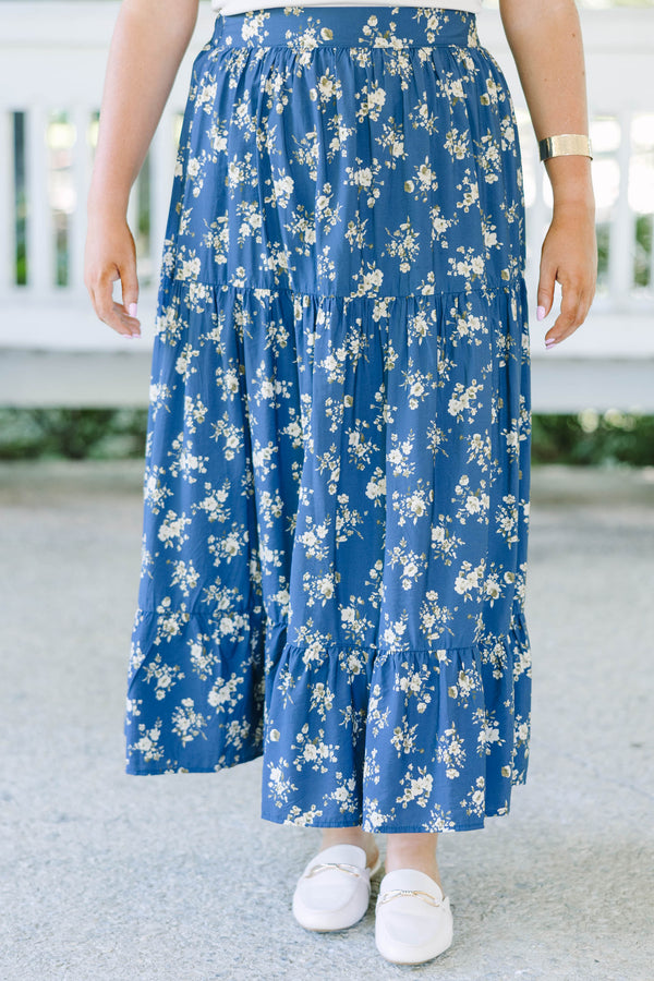 Plus Size navy floral tiered maxi skirt with an elastic waistband and functional pockets.