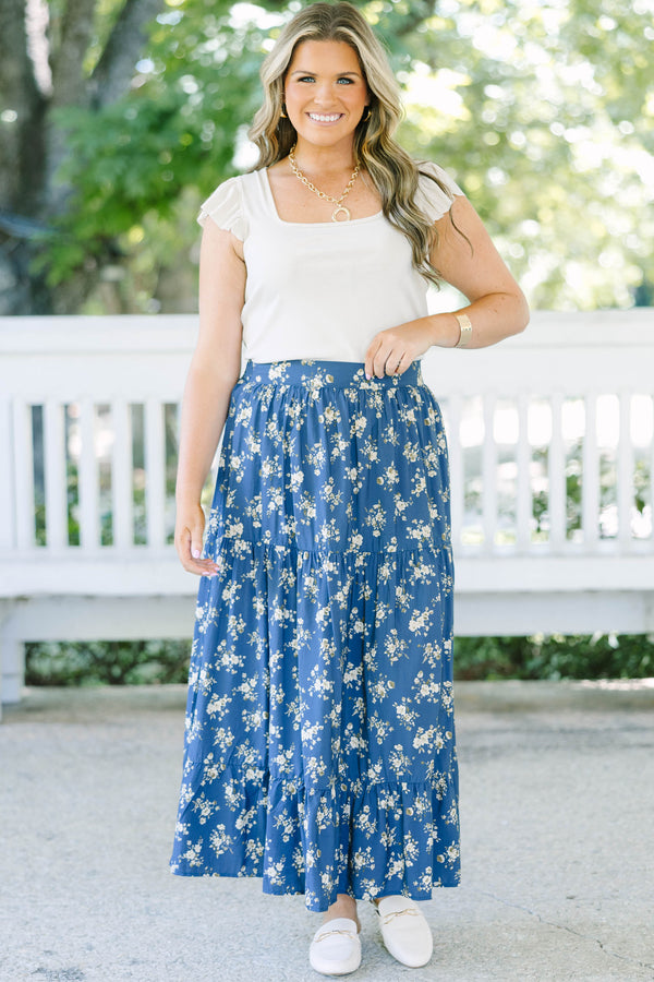 Plus Size navy floral tiered maxi skirt with an elastic waistband and functional pockets.