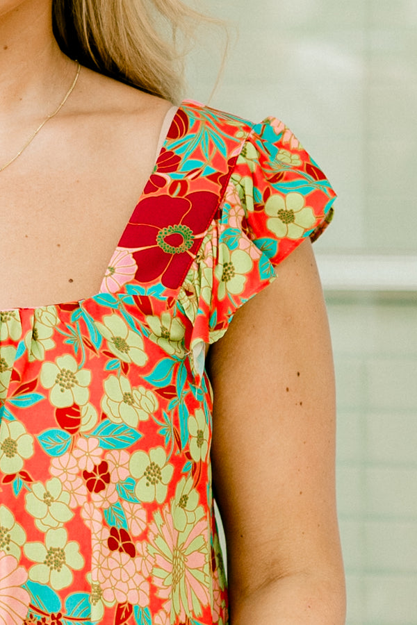 Chic Soul Plus size clothing, pink multi-color top with a floral pattern, square neckline and flutter sleeves 
