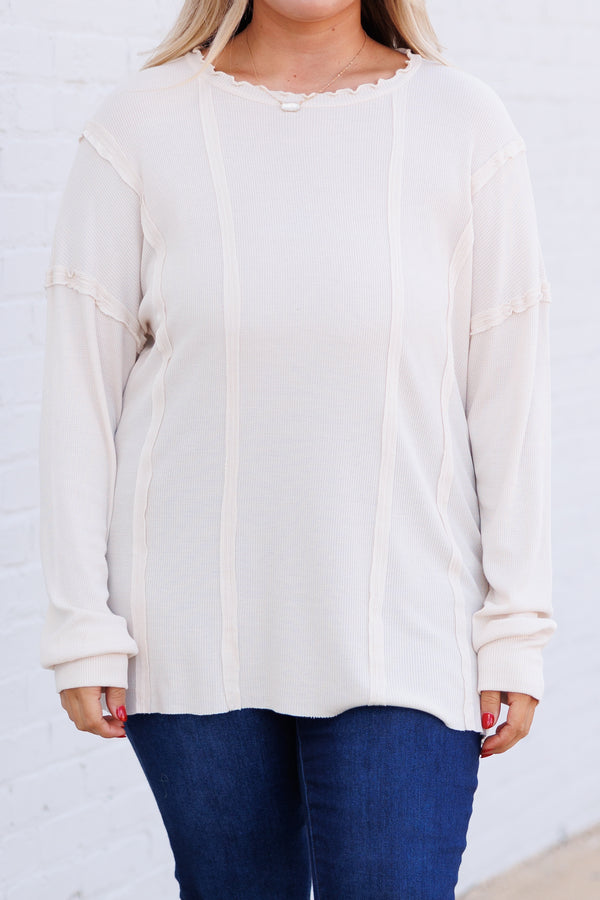 Chic Soul plus size clothing, cream colored long sleeve top with outward inseam detailing and raw hemilne on neckline